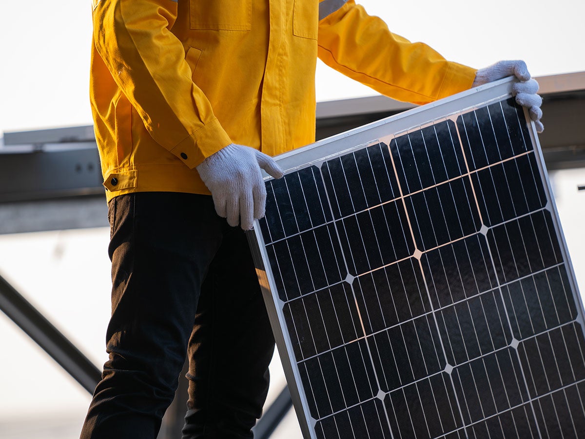 A person installing an AC unit