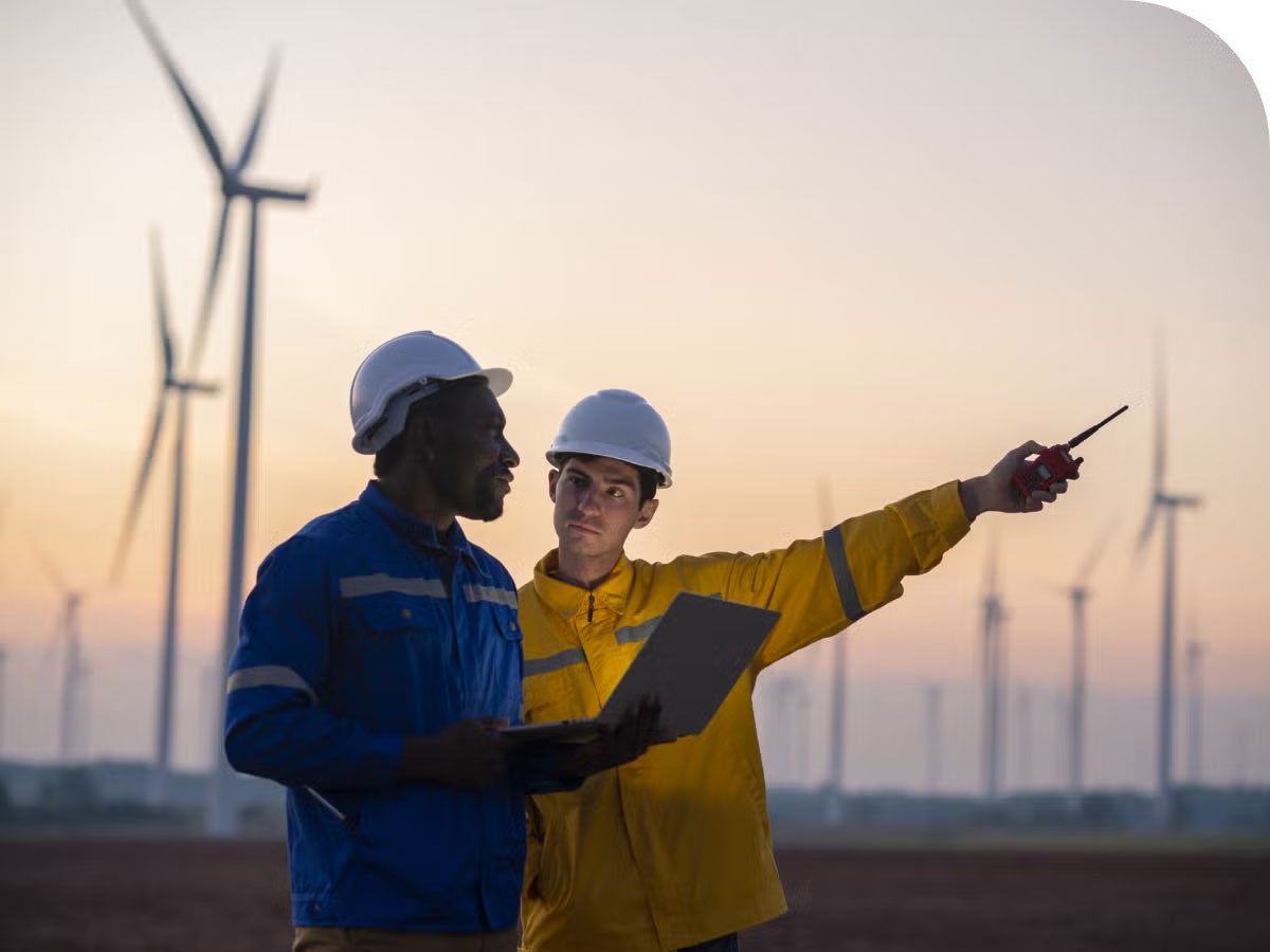 Two people working at a wind farm