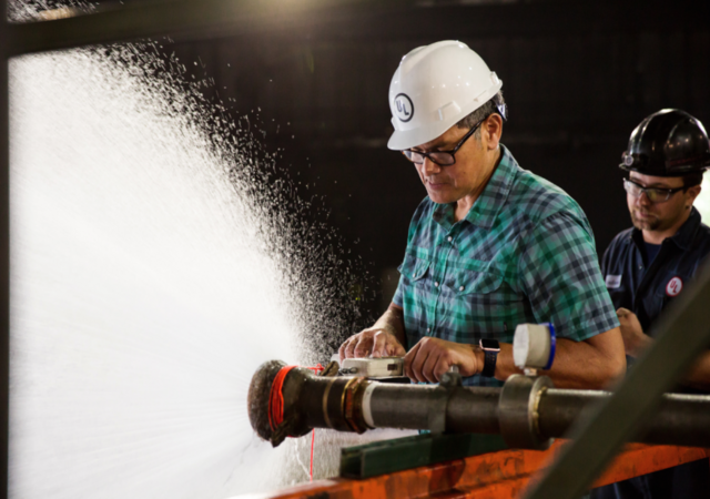 UL testing engineer testing a fire hose