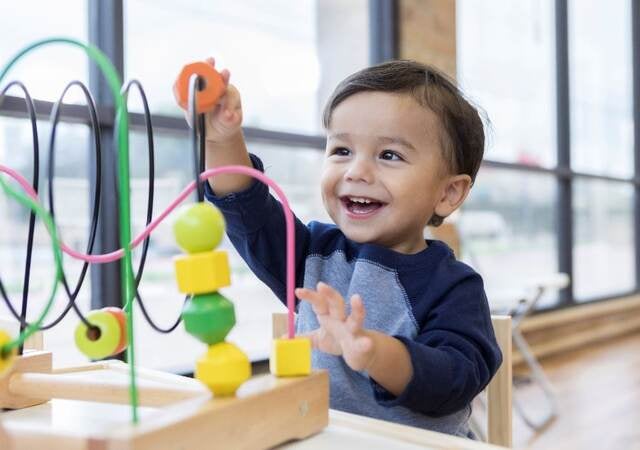 Toddler playing with a toy