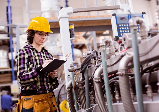 Female Engineer inspecting plant