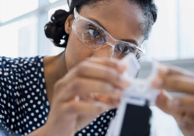 Woman scientist testing a sample