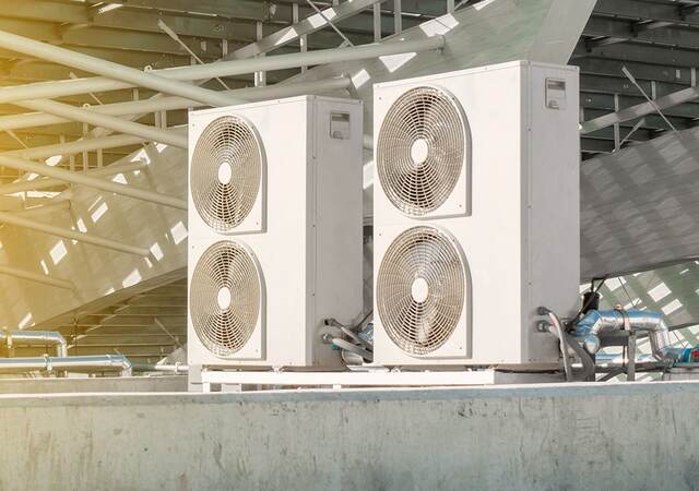 Air conditioning compressor installation outside building