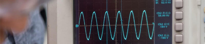 Engineer using a function generator