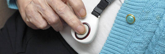 Senior citizen using emergency call button