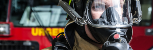 Fire fighter wearing protective equipment and face shield