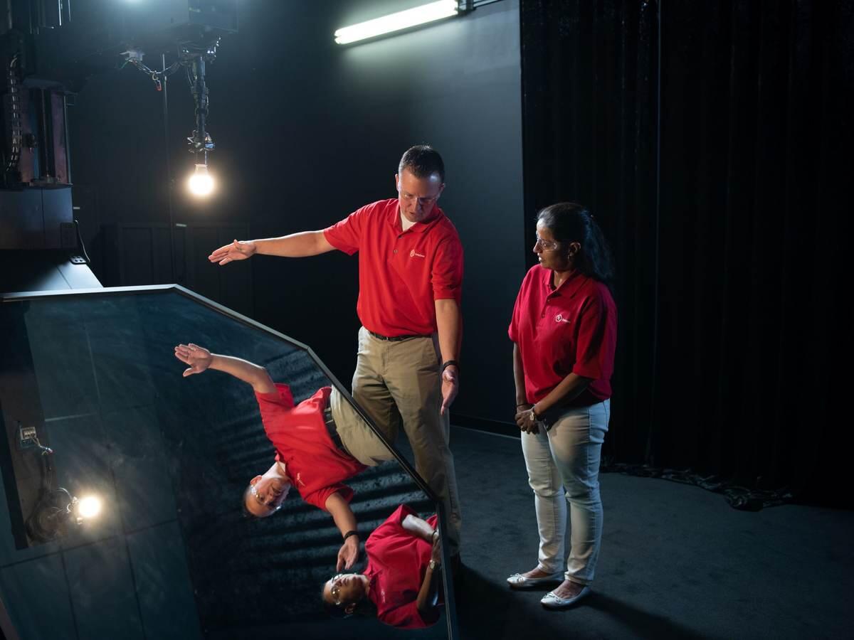 Two UL Solutions employees working at the Allentown lighting laboratory.