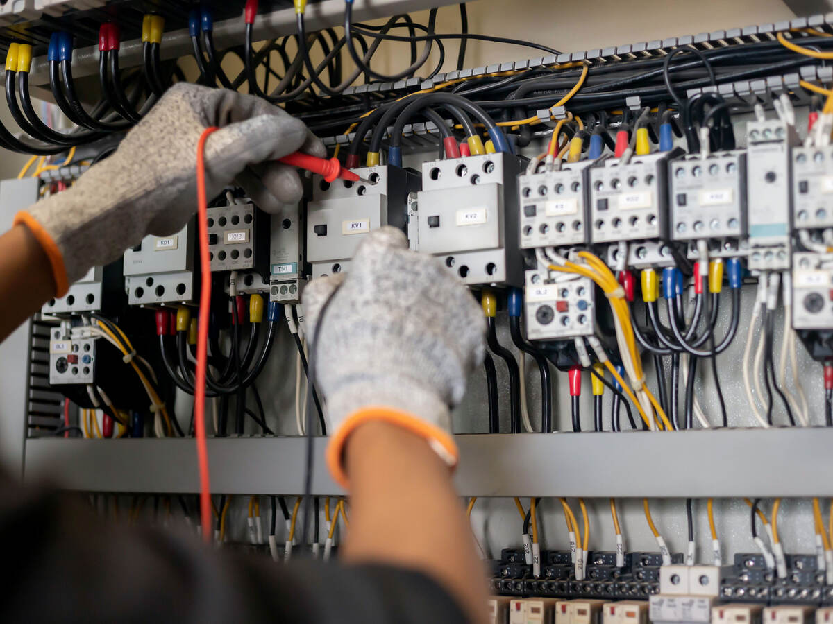 an engineer using a multimeter