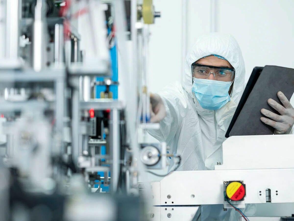 An engineer using a digital tablet for inspection