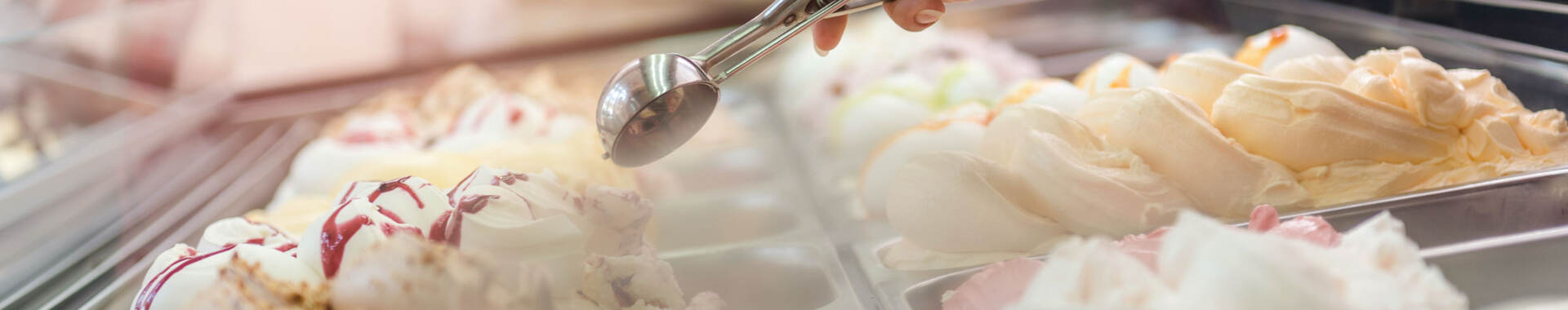 Person shopping in cold storage section of supermarket