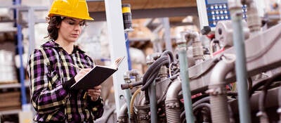 Female Engineer inspecting plant