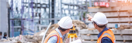 Two engineers in construction site