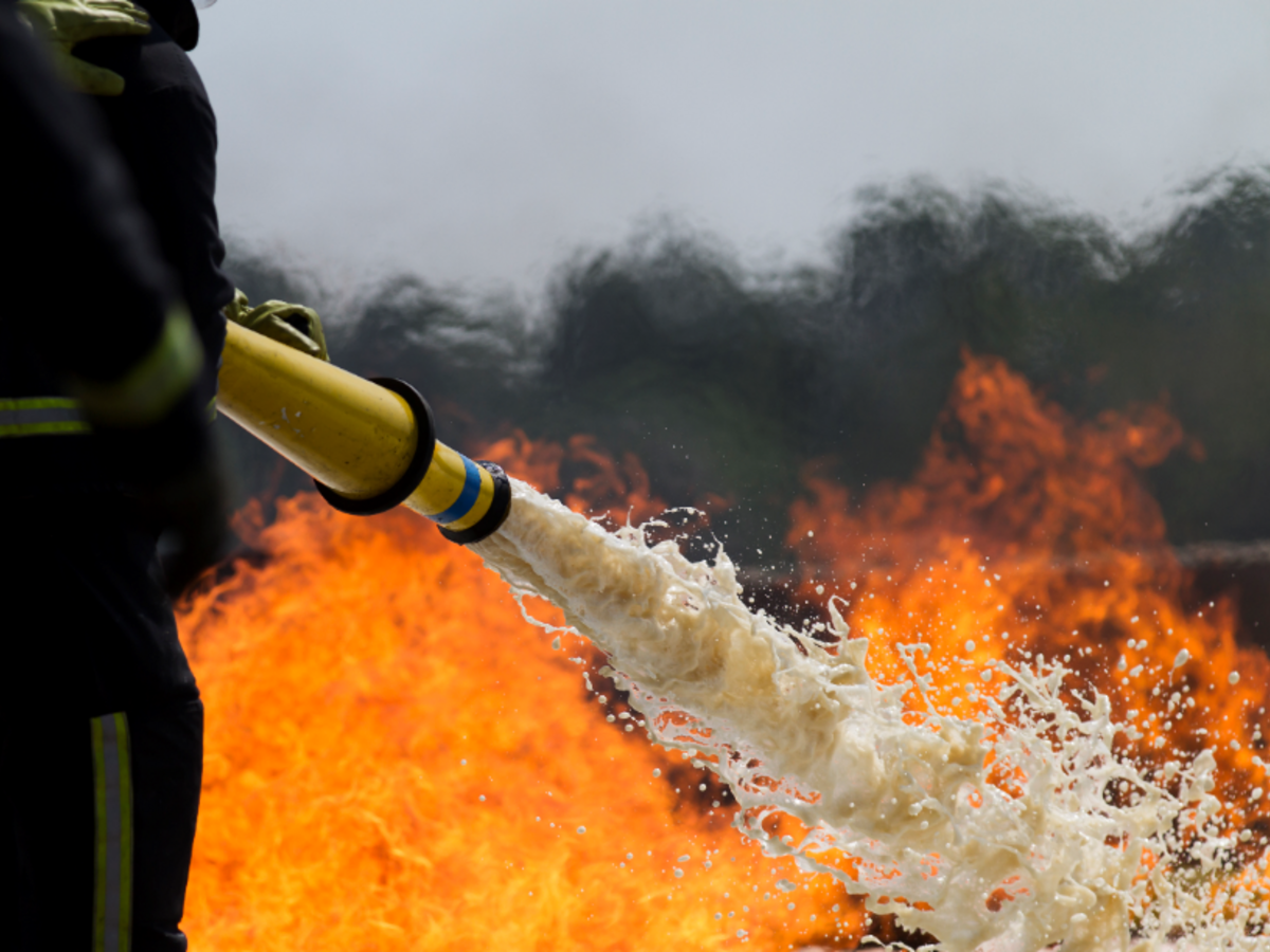 Fire hose spraying fire