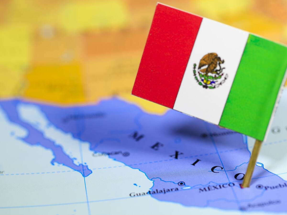Picture of the Mexican flag fixed in Mexican country on a world map