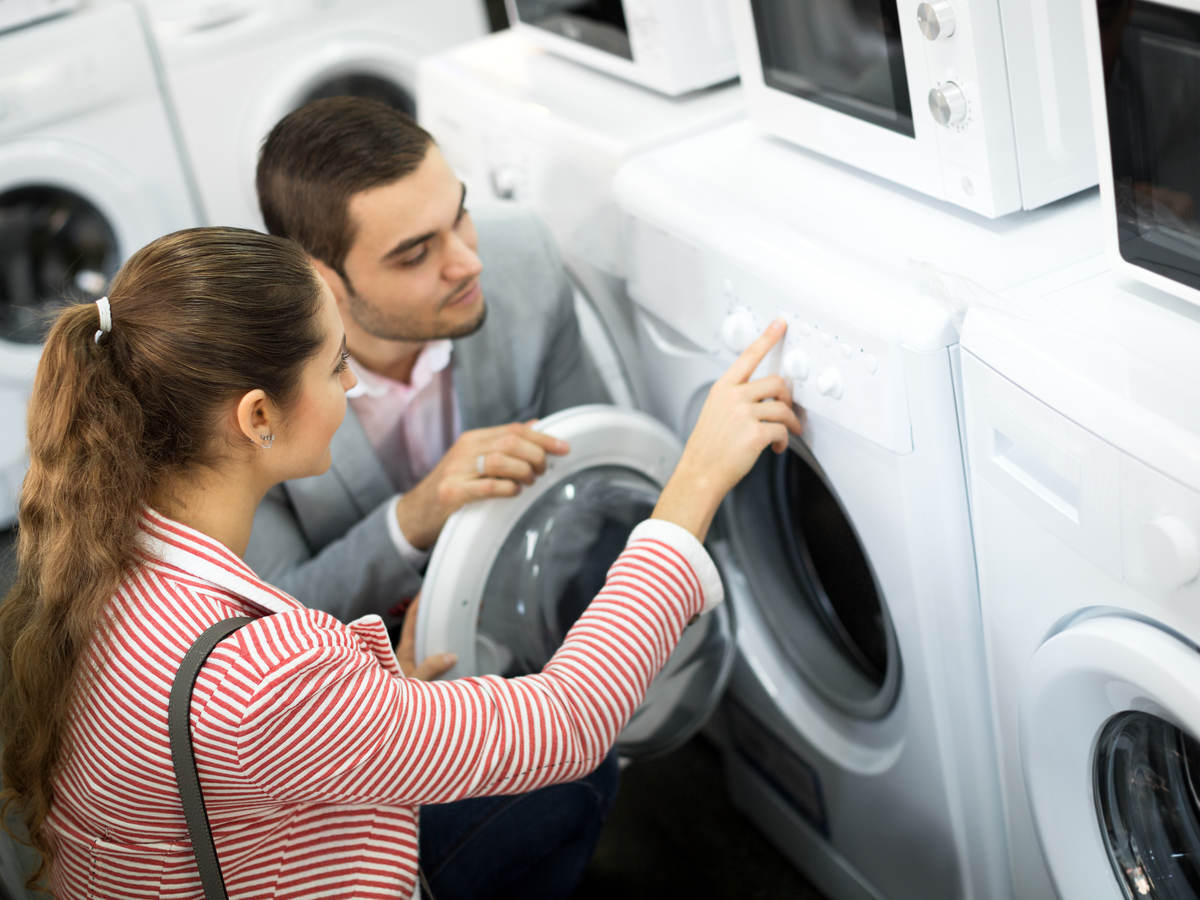 Young couple shopping for dryer