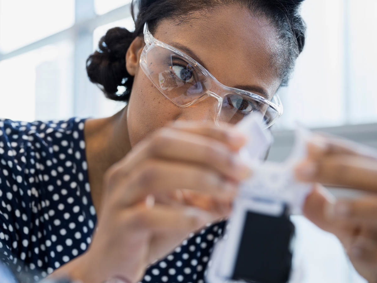 Woman scientist testing a sample
